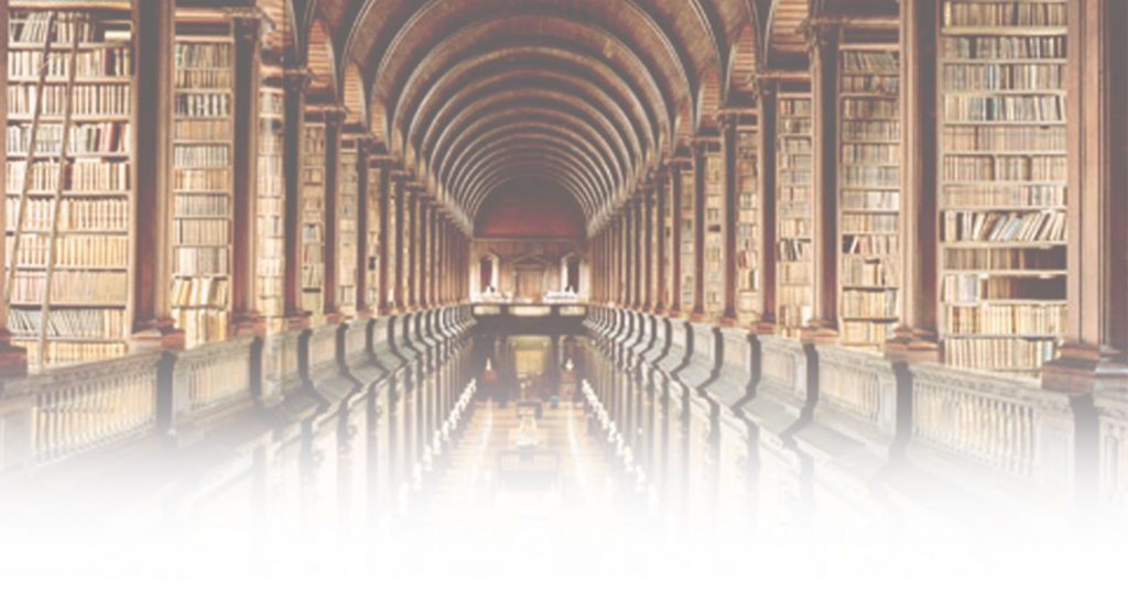 A long hallway with many pillars and books